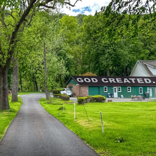 IN THE BEGINNING, GOD CREATED… A Rooftop Testimony at the Entrance of Eddy Farm